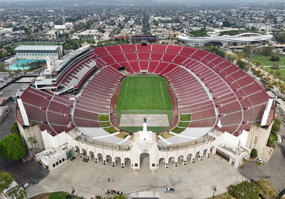 Aerial view of the Los Angeles Memorial Coliseum, its red seating and historic entrance
